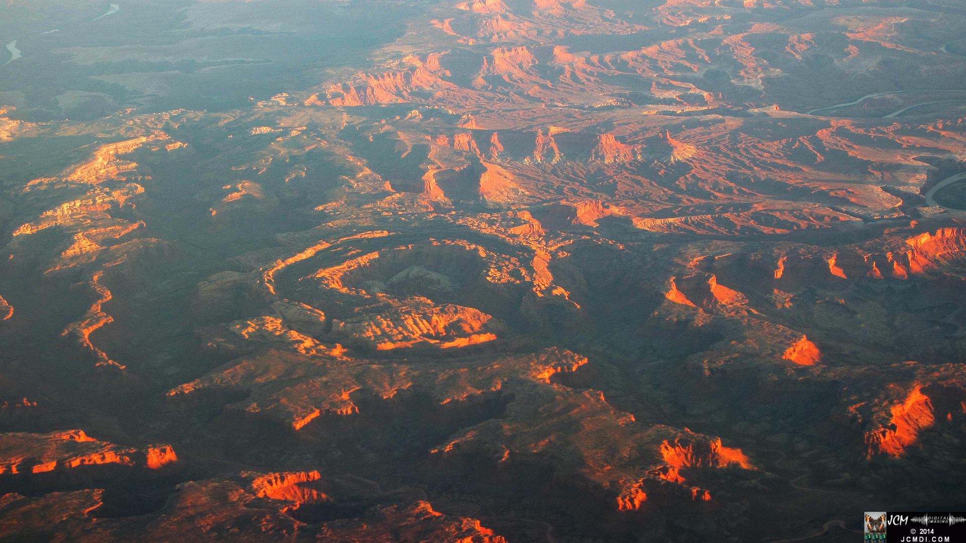 MSP-LAX canyon terrain sunset ridges from airline window double crater rings